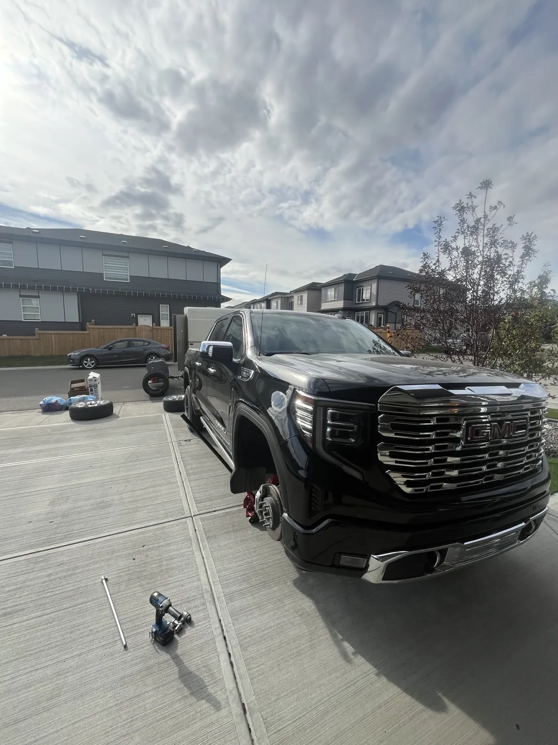 Brand new tires supplied and installed at customer home for GMC Sierra in Edmonton by Dama Mobile Tire Shop