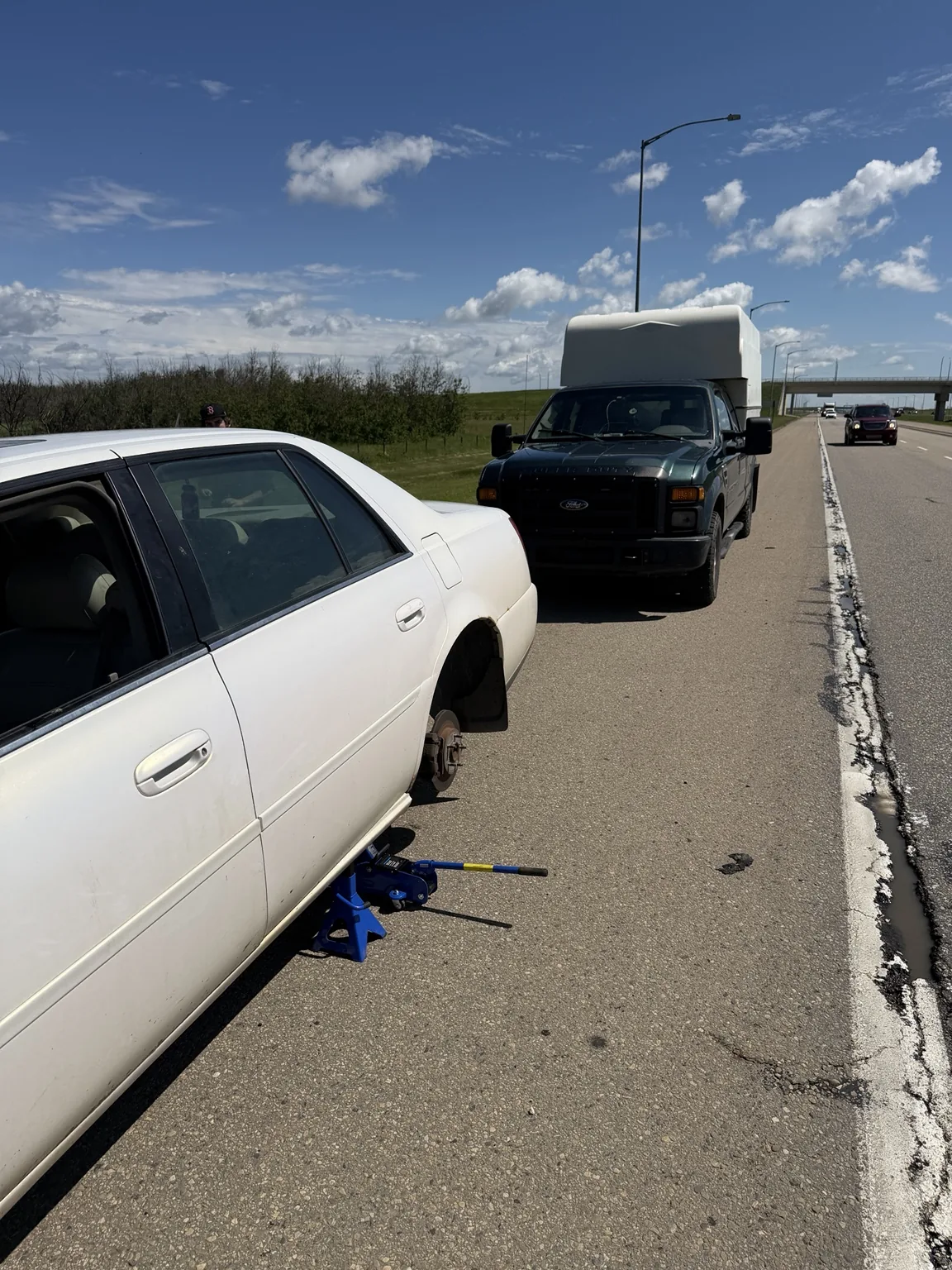 Roadside Tire Changeover for a Cadillac on Anthony Henday Way in Edmonton