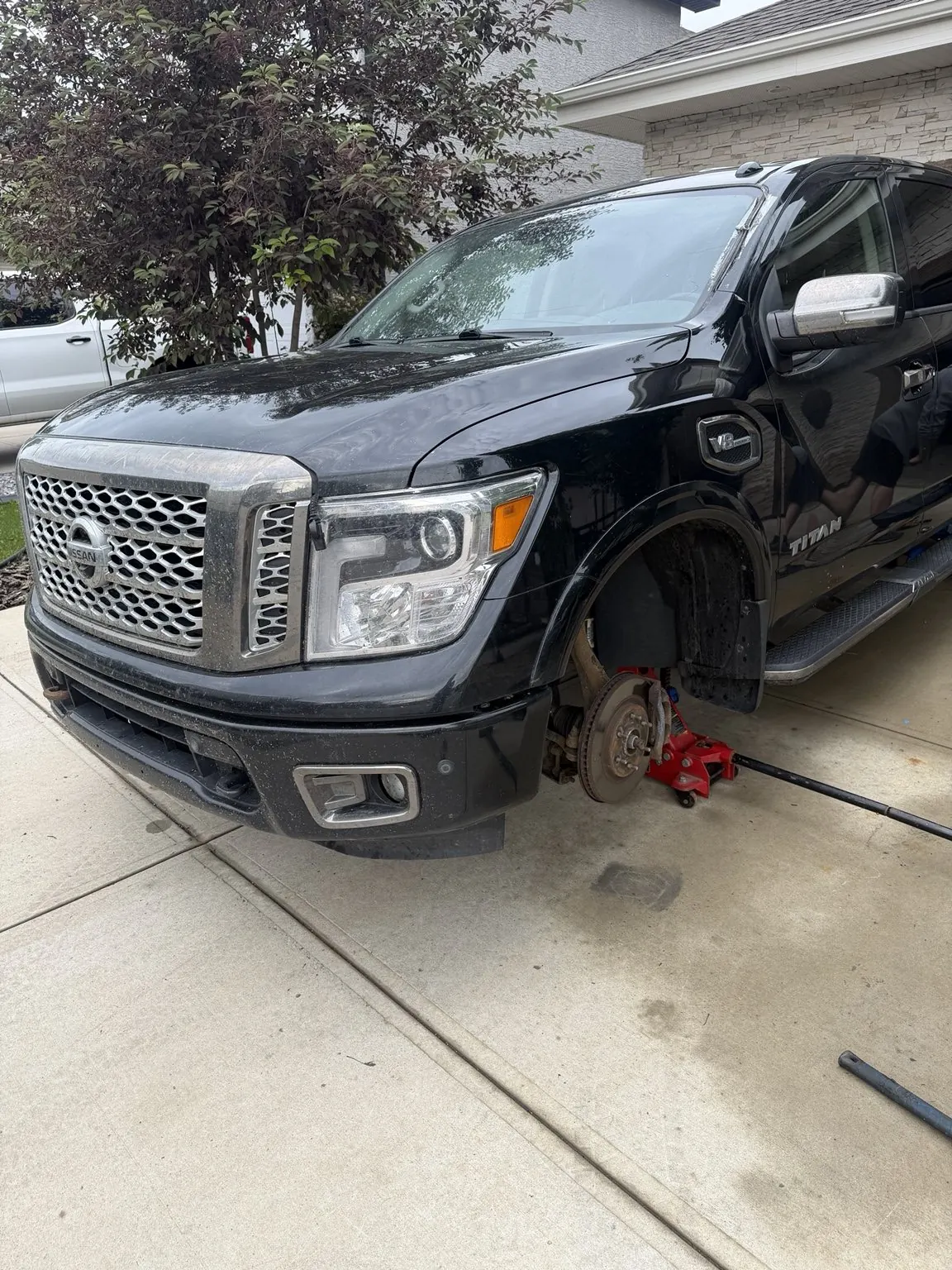 Seasonal Tire Changeover and Wheel Balancing on Nissan Titan Platinum in Edmonton photo